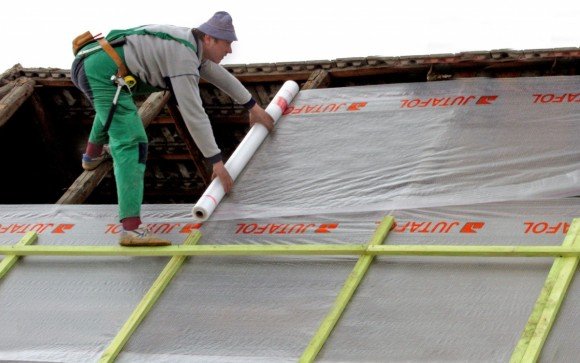 Laying waterproofing material
